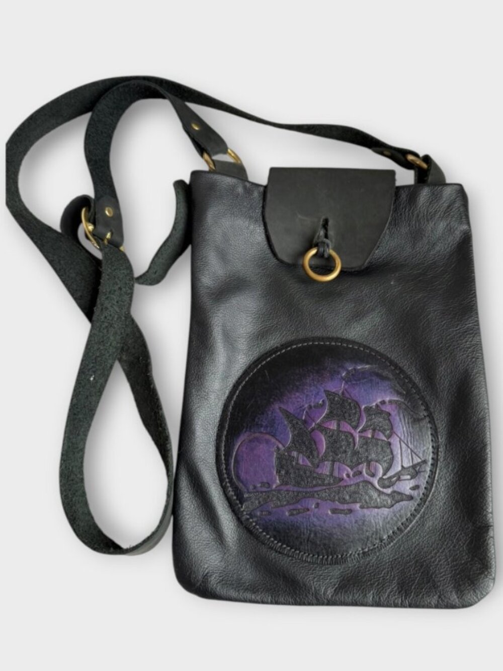 Black Leather Crossbody Bag with an Embossed Purple Design With a Sailing Ship
